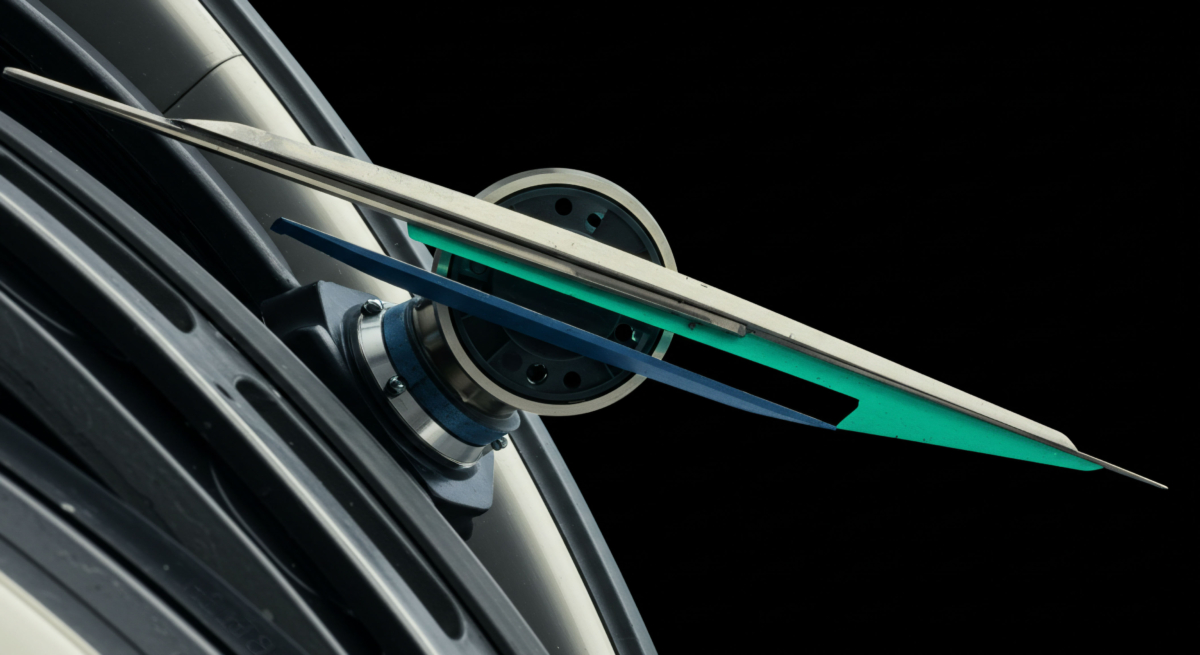 Precision mechanics illustrating institutional RFQ protocol dynamics. Metallic and blue blades symbolize principal's bids and counterparty responses, pivoting on a central matching engine. This visualizes high-fidelity execution and price discovery for digital asset derivatives, emphasizing low latency and capital efficiency.